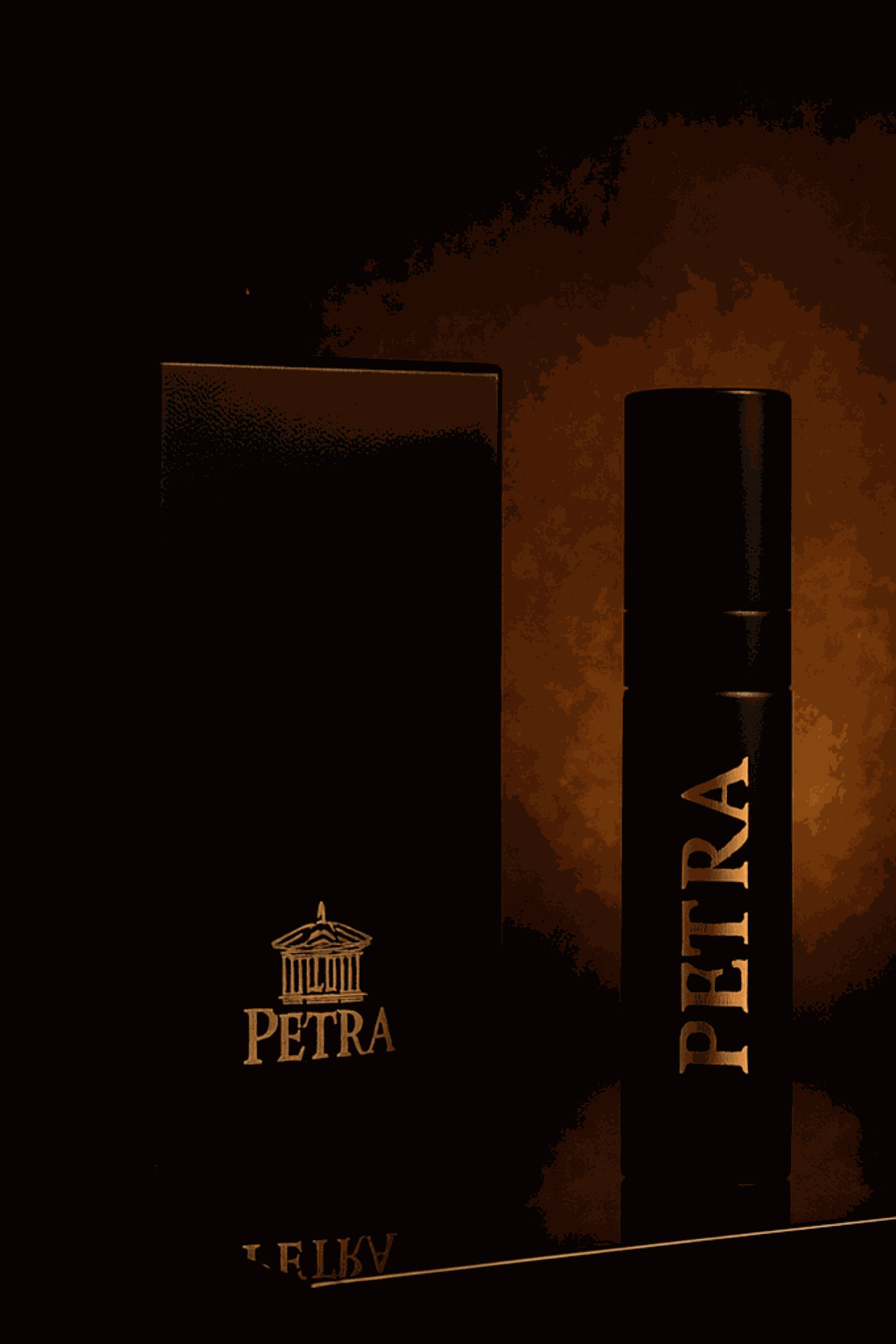 Black PETRA FOR HER perfume bottle and packaging with gold lettering against dark background