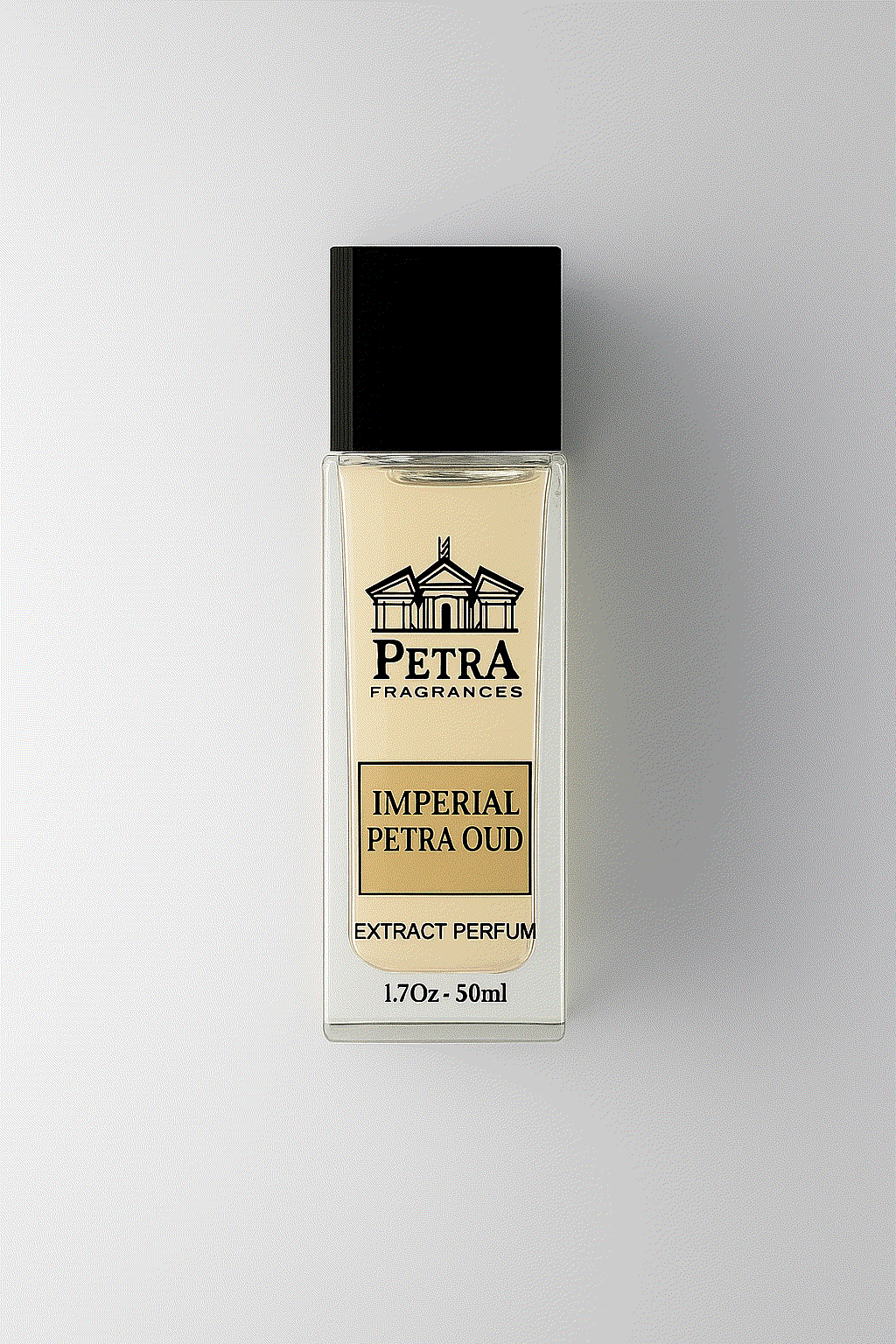 Imperial Petra Oud perfume bottle with black cap and gold label on a light background
