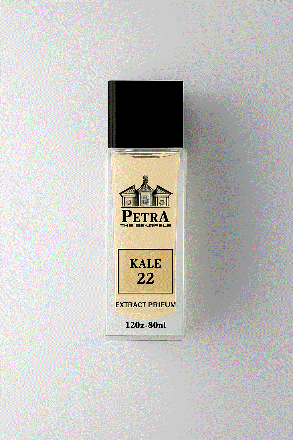 Petra's Kale 22 fragrance bottle with black cap and golden label on light background