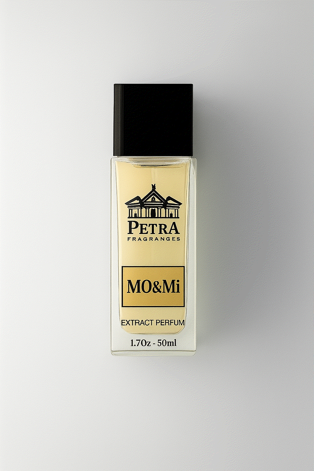 Mo & Mi perfume by Petra Fragrances in a 50ml clear rectangular bottle with black cap and amber liquid inside