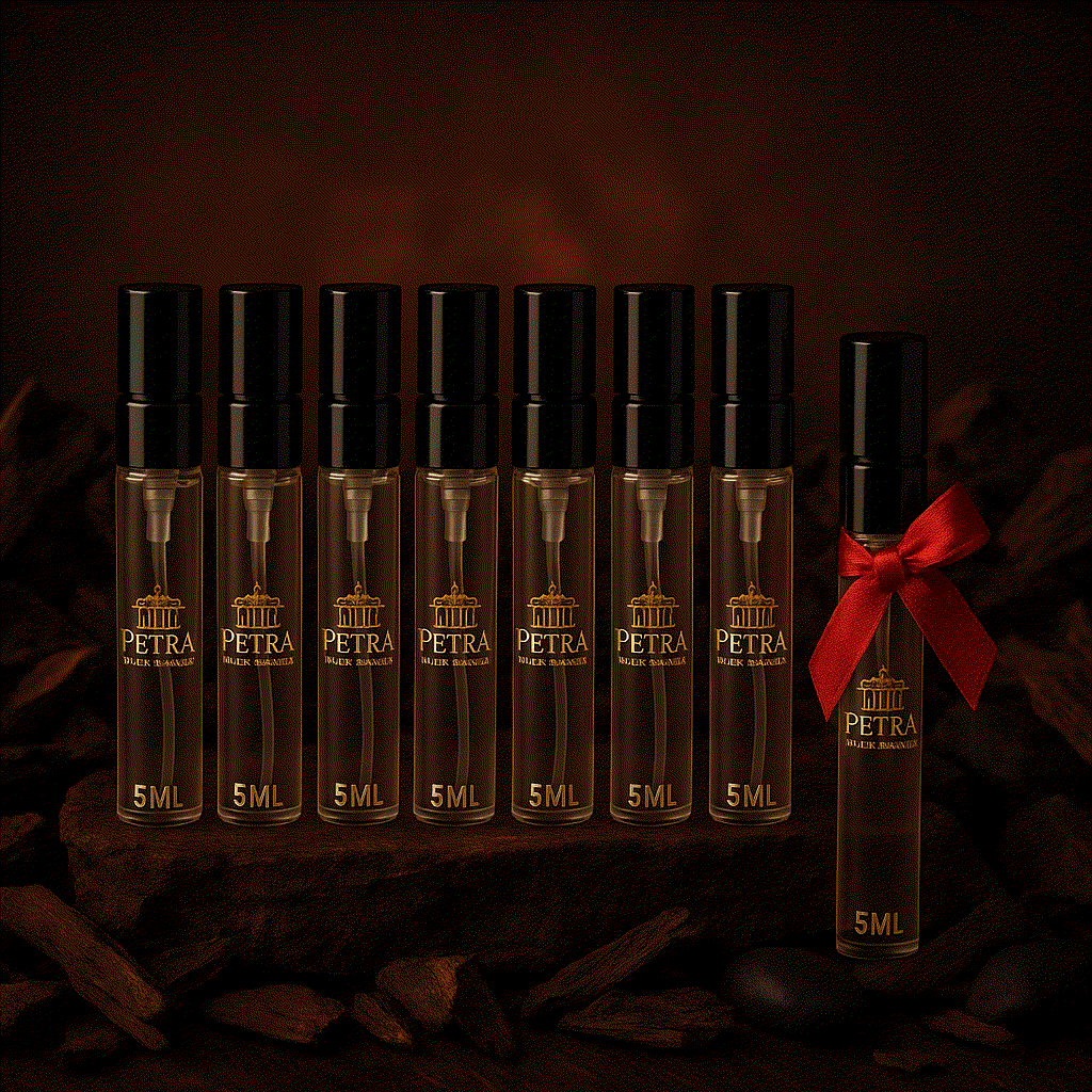 IMAGIN PETRA perfume 5ml vials with top notes of bergamot, mandarin, ginger; heart notes of jasmine, lavender, violet; base notes of sandalwood, vanilla, amber, one vial tied with red ribbon